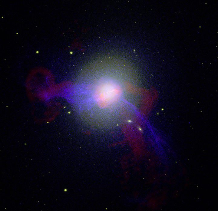 This image of M87 is a composite of several photos in the visible, radio and X-ray spectra. Credit NASA/NRAO/ESA/Hubble Heritage Team